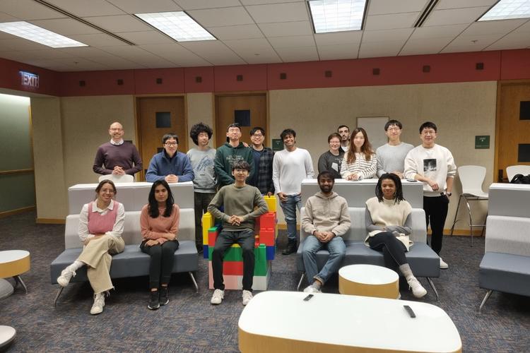 Schroeder group photo inside Beckman Institute